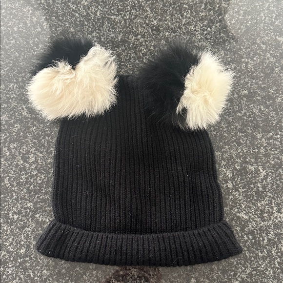 Charlotte Simone 100% cashmere hat with fox fur pompoms. Black and cream.